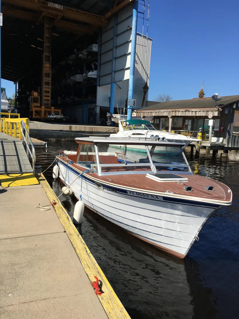 Slide: The Image of 1979 Skiff Craft Hard Top Cruiser docked at a marina. - 10