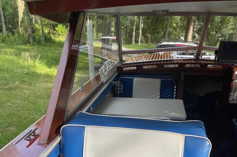 Slide: The Image of 1979 Skiff Craft Hard Top Cruiser interior with blue and white seating. - 19