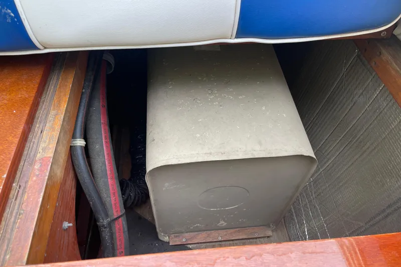 Slide: The Image of 1979 Skiff Craft Hard Top Cruiser engine compartment with visible components. - 23