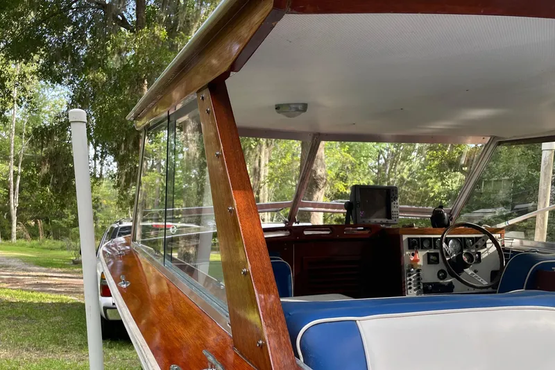 Slide: The Image of 1979 Skiff Craft Hard Top Cruiser with wooden trim and blue interior. - 24