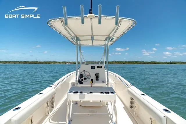 Slide: The Image of 2021 Cobia 201 Center Console boat on open water, clear sky, and calm sea. - 6