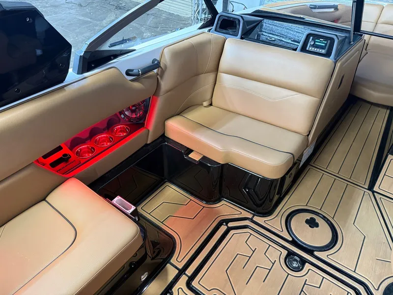 Slide: The Image of Interior of a 2024 Moomba Mojo with beige leather seats and stylish lighting. - 18