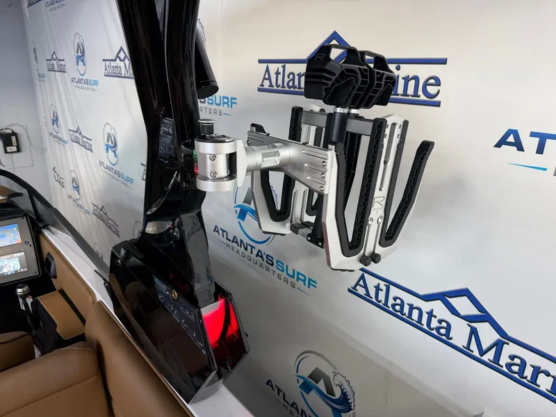Slide: The Image of A 2024 Moomba Mojo boat with a modern wakeboard rack on the side. - 13