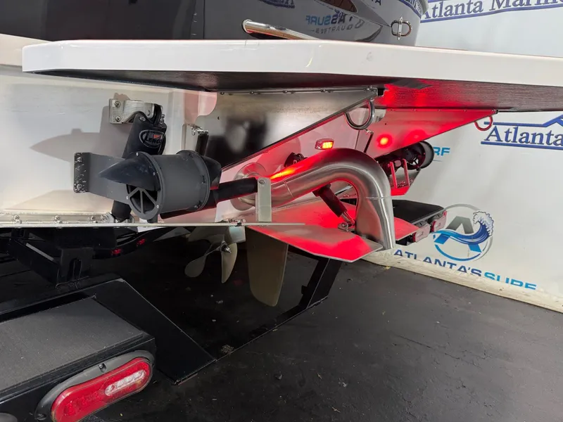 Slide: The Image of The image shows the stern of a 2024 Moomba Mojo boat with propeller and exhaust. - 9