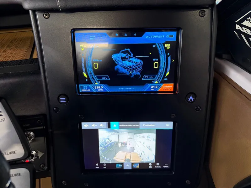 Slide: The Image of The dashboard of a 2024 Moomba Mojo with digital displays. - 22