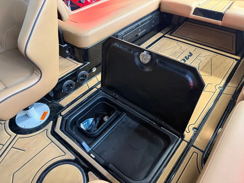 Slide: The Image of The image shows the interior of a 2024 Moomba Mojo with an open storage compartment. - 27