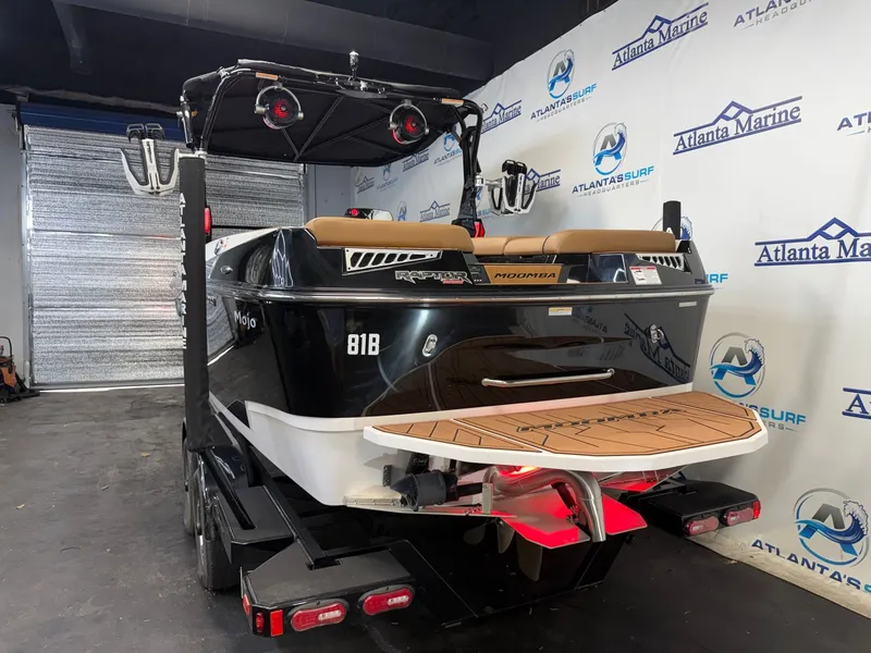 Slide: The Image of The image shows a 2024 Moomba Mojo boat in a warehouse. - 6