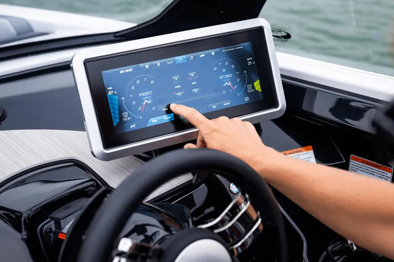 Slide: The Image of Touchscreen dashboard of 2024 Yamaha Boats 222XD being operated. - 28