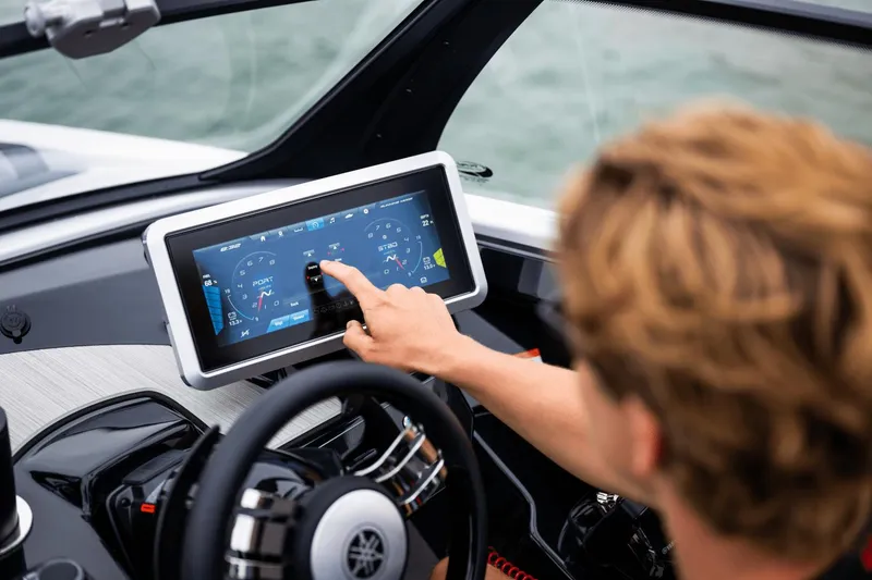 Slide: The Image of 2024 Yamaha Boats 222XD touchscreen dashboard interface in use. - 29