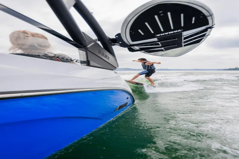 Slide: The Image of 2024 Yamaha Boats 222XD with wakeboarder surfing behind. - 35