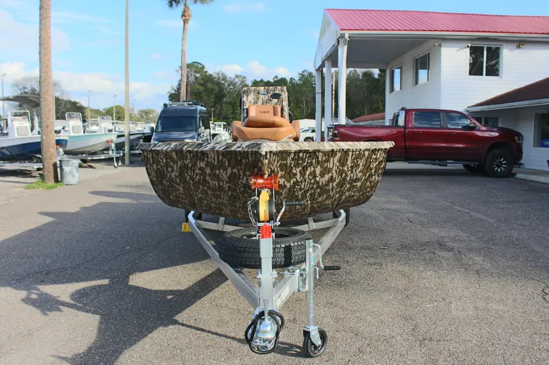 Slide: The Image of 2024 Avid 20 Rogue boat on a trailer in a dealership lot. - 10