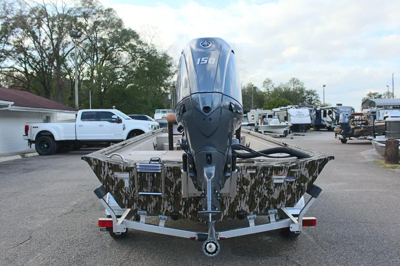Slide: The Image of 2024 Avid 20 Rogue boat with 150 HP engine on trailer. - 14