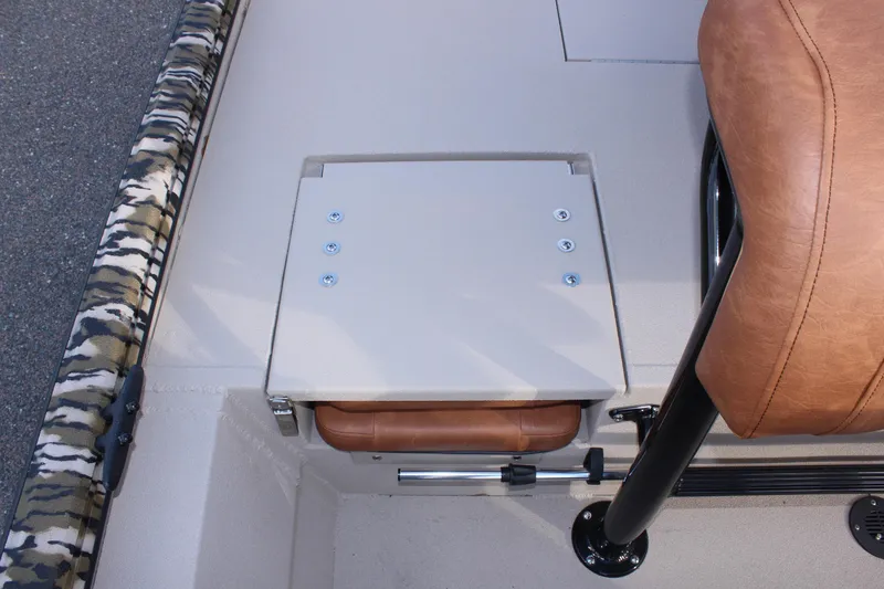 Slide: The Image of 2024 Avid 20 Rogue boat interior with camo trim and leather seating. - 22