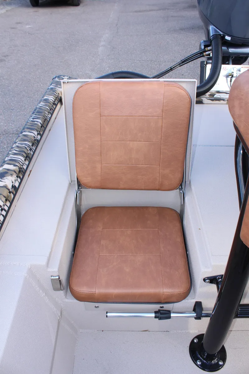 Slide: The Image of 2024 Avid 20 Rogue boat with tan leather seat. - 23