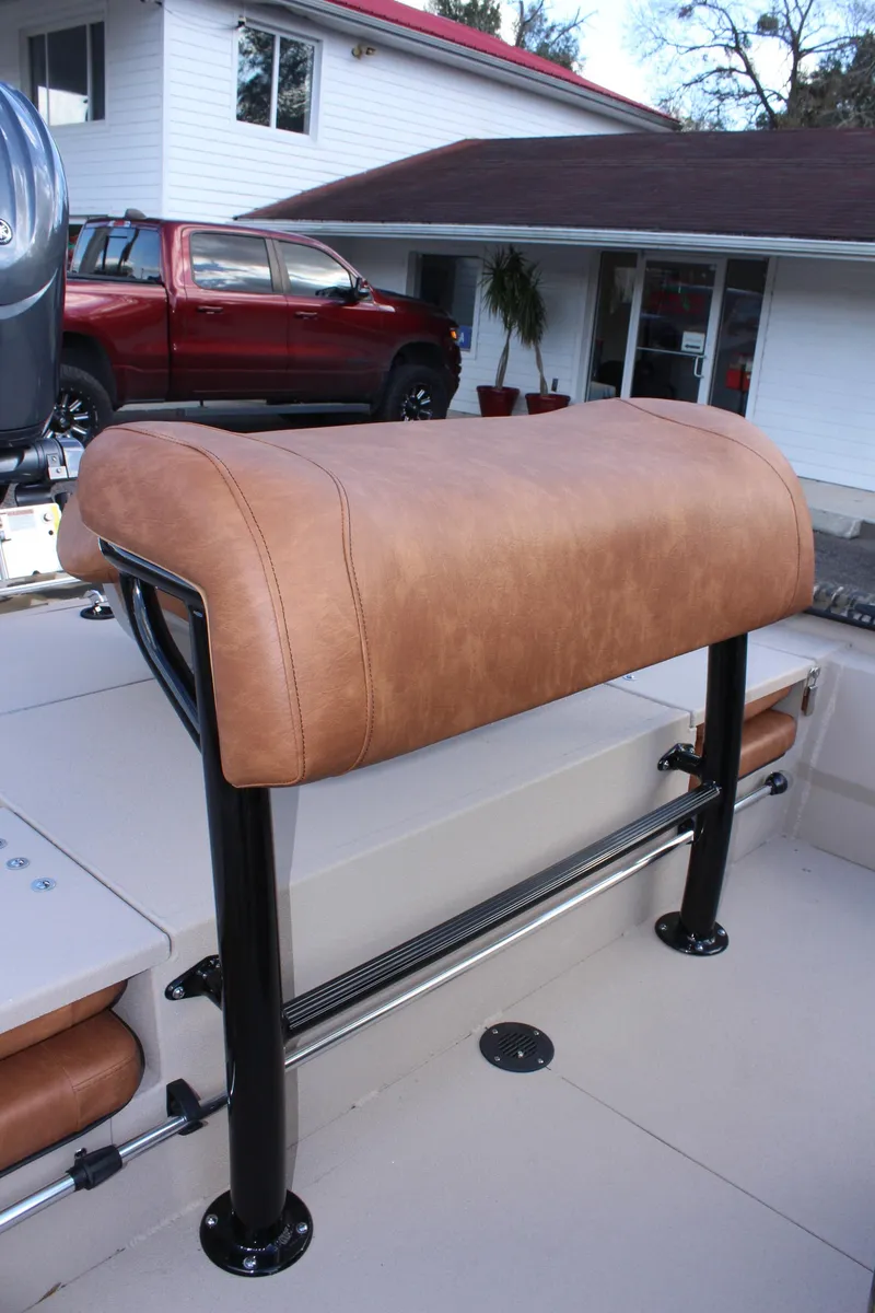 Slide: The Image of 2024 Avid 20 Rogue boat with tan leather seating and black metal frame. - 24