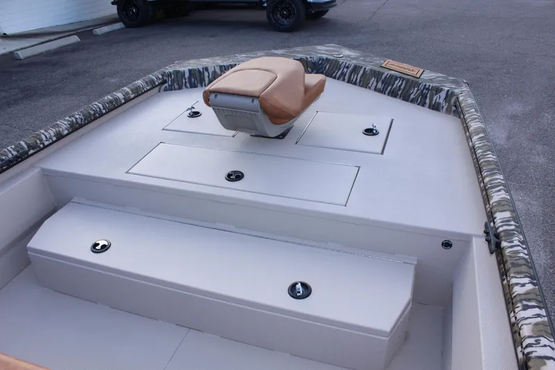Slide: The Image of 2024 Avid 20 Rogue boat interior with storage compartments and seating. - 31