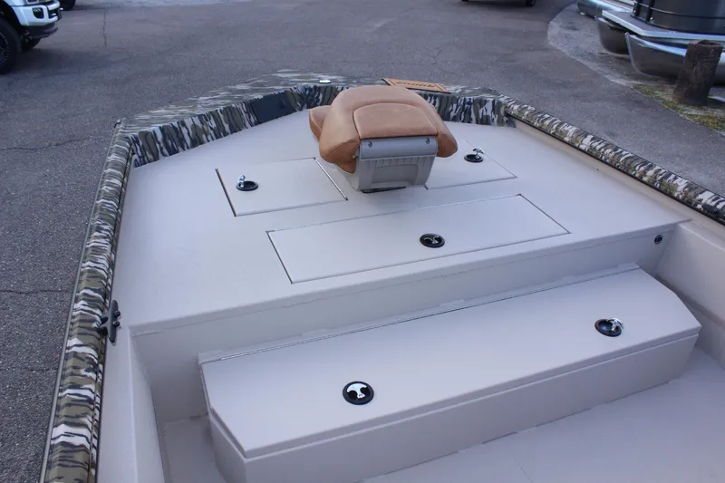 Slide: The Image of 2024 Avid 20 Rogue boat interior with storage compartments and seating. - 32