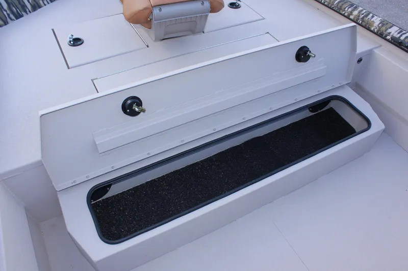 Slide: The Image of 2024 Avid 20 Rogue boat storage compartment with open lid. - 33