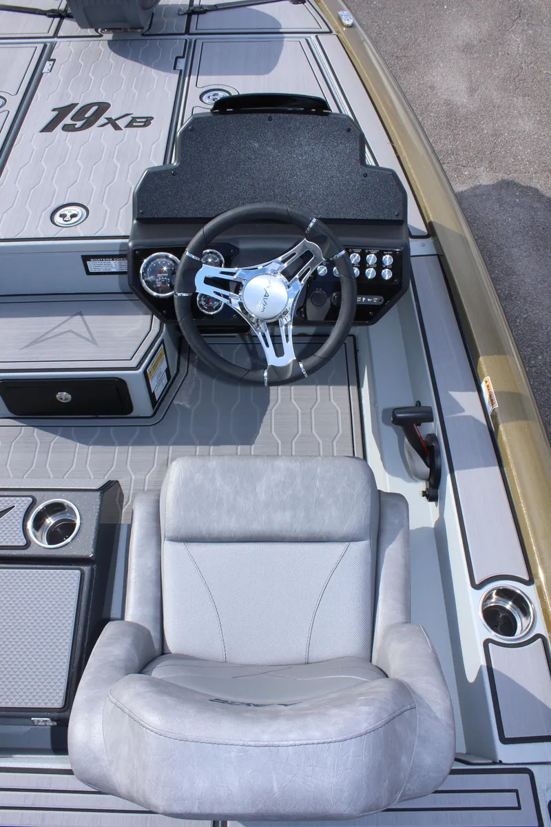 Slide: The Image of 2024 Avid 19 XB boat interior with steering wheel and captain's chair. - 14