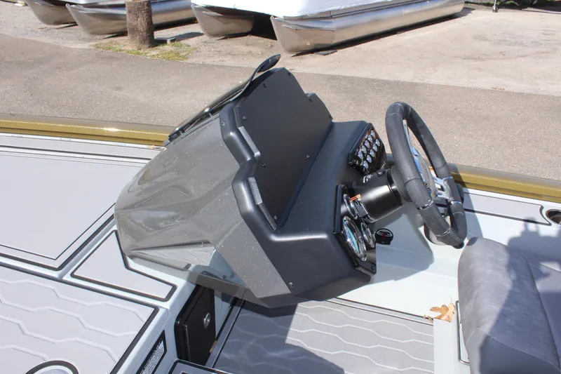 Slide: The Image of 2024 Avid 19 XB boat dashboard and steering wheel. - 16