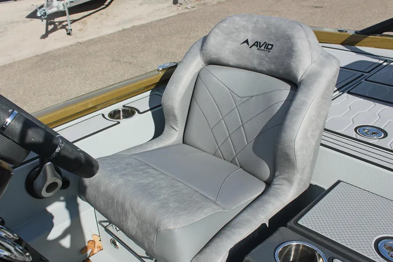 Slide: The Image of 2024 Avid 19 XB boat captain's seat with gray upholstery and ergonomic design. - 19