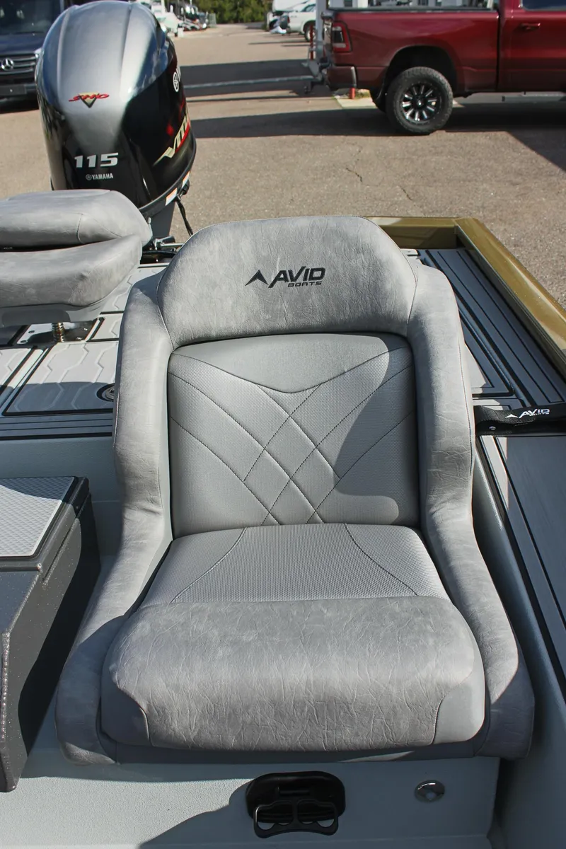 Slide: The Image of 2024 Avid 19 XB boat seat with motor in background. - 20