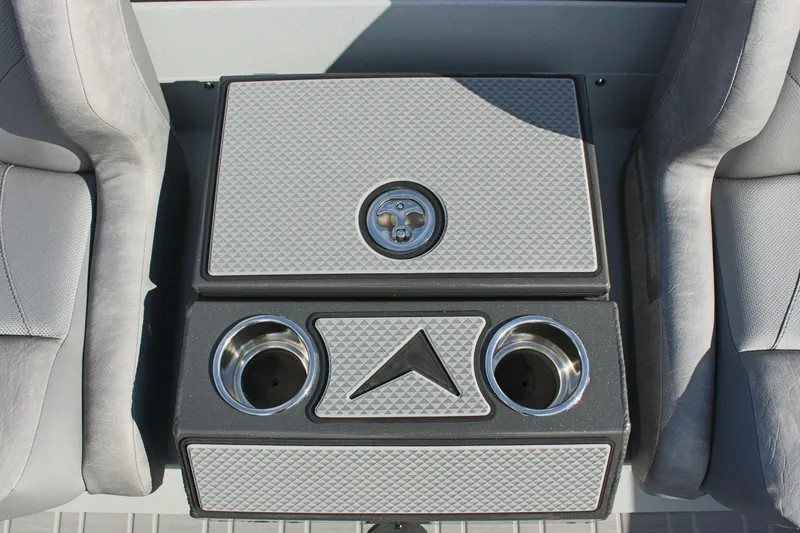 Slide: The Image of Avid 19 XB 2024 boat interior with cup holders and storage compartment. - 21