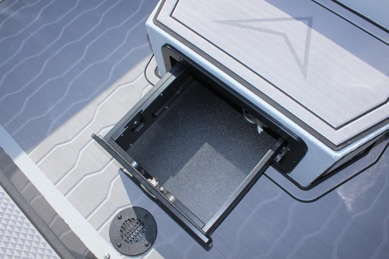 Slide: The Image of Open storage compartment on 2024 Avid 19 XB boat. - 27