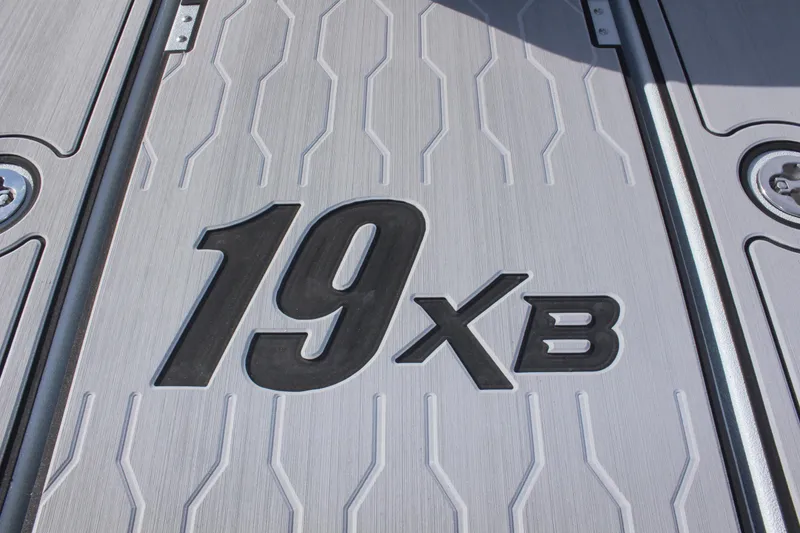Slide: The Image of 2024 Avid 19 XB boat deck with model logo. - 28
