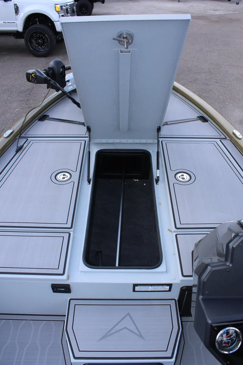 Slide: The Image of 2024 Avid 19 XB boat with open storage compartment. - 31