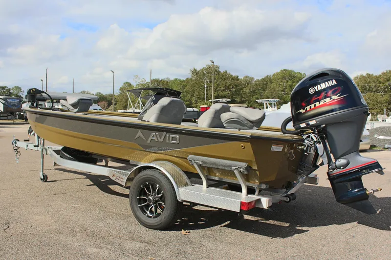 Slide: The Image of 2024 Avid 19 XB boat on trailer with Yamaha VMAX outboard motor. - 8
