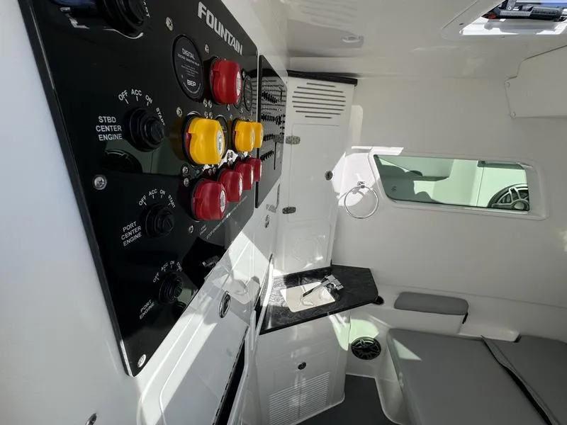 Slide: The Image of 2024 Fountain 38 SCX boat interior with control panel and seating area. - 12