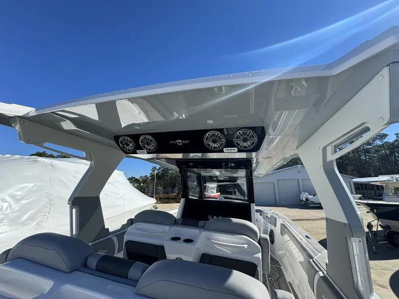 Slide: The Image of 2024 Fountain 38 SCX boat interior with modern seating and overhead speakers. - 15