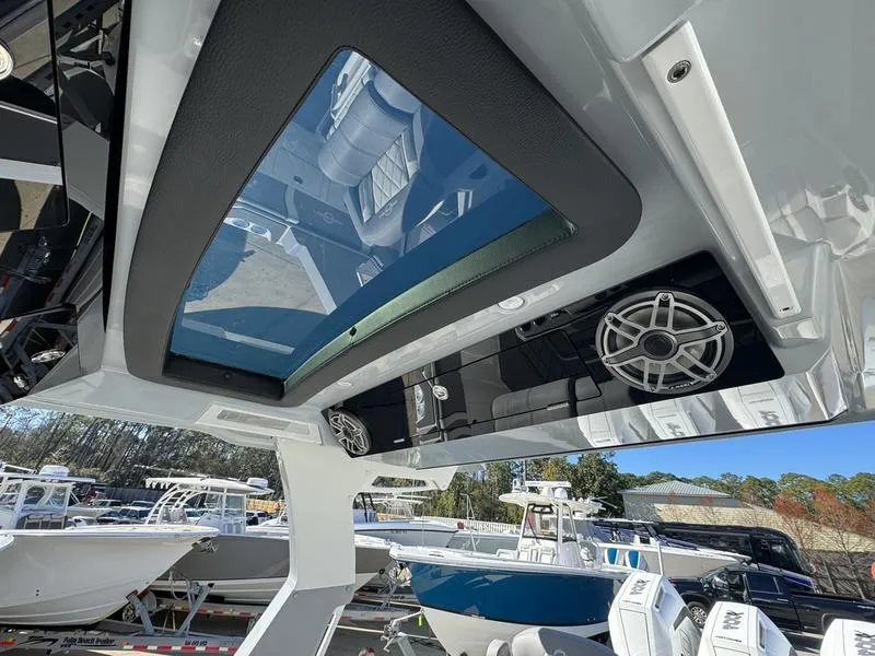Slide: The Image of 2024 Fountain 38 SCX boat interior with skylight and speaker system. - 18