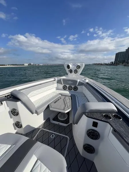 Slide: The Image of 2024 Fountain 38 SCX boat interior with seating and ocean view. - 20