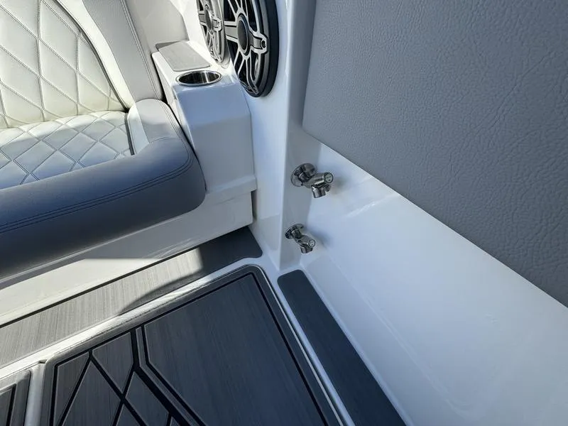 Slide: The Image of 2024 Fountain 38 SCX boat interior, featuring luxury seating and high-quality speaker system. - 21