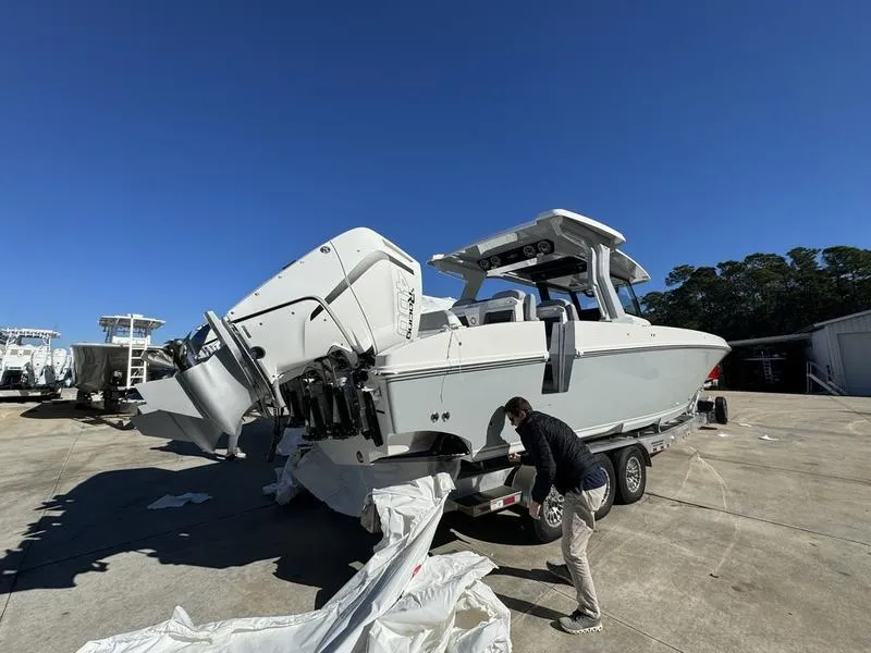 Slide: The Image of 2024 Fountain 38 SCX boat being prepared on a trailer. - 23
