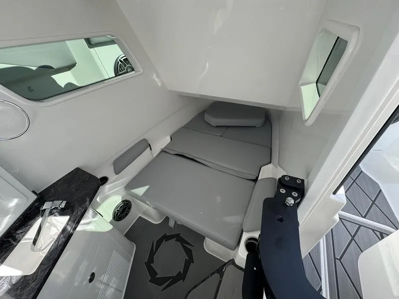 Slide: The Image of 2024 Fountain 38 SCX cabin interior with cushioned seating and windows. - 3