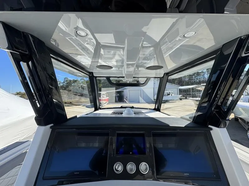Slide: The Image of 2024 Fountain 38 SCX boat dashboard with advanced navigation system. - 6