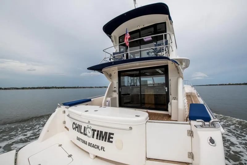 Slide: The Image of 2007 Maritimo Enclosed Fly Bridge yacht on calm water. - 12