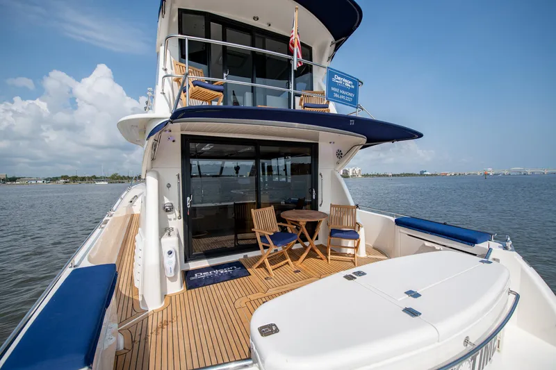 Slide: The Image of 2007 Maritimo Enclosed Fly Bridge yacht on water, rear view. - 14