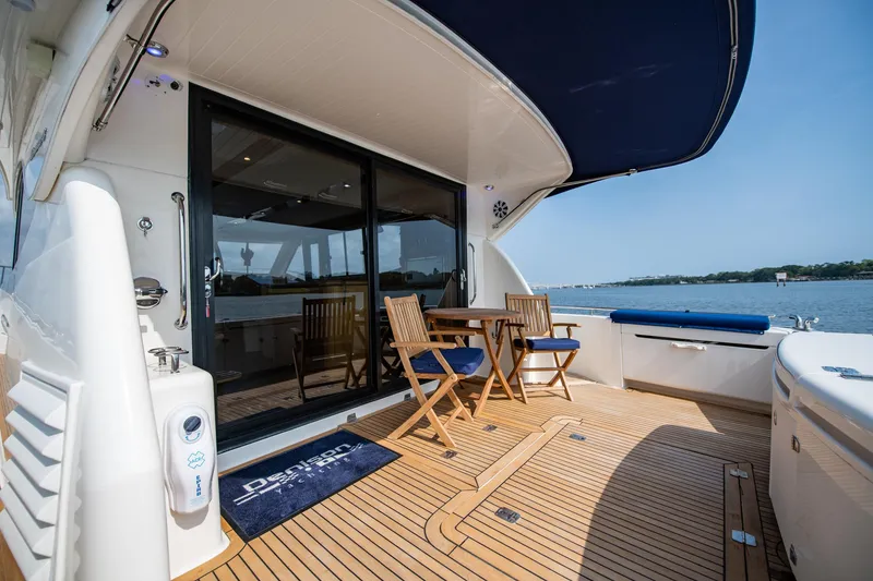 Slide: The Image of 2007 Maritimo Enclosed Fly Bridge boat stern view with wake in water. - 15