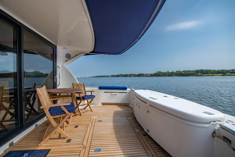 Slide: The Image of 2007 Maritimo Enclosed Fly Bridge yacht with spacious deck and seating area. - 16