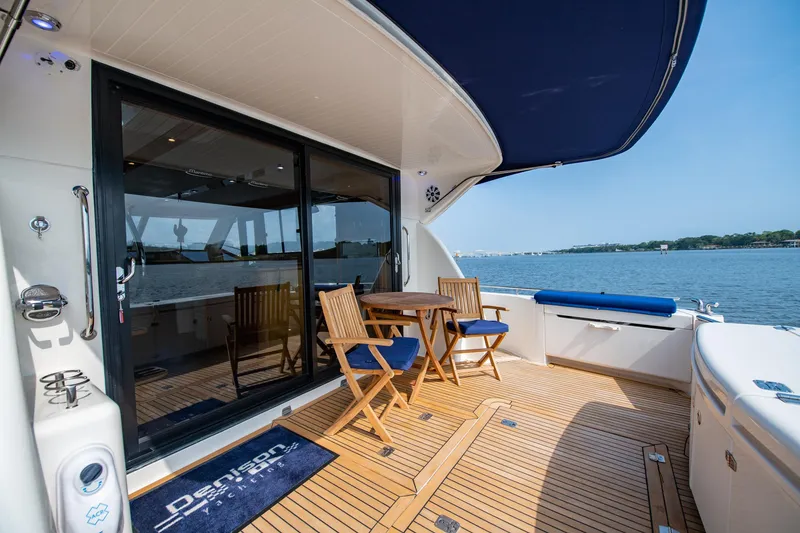 Slide: The Image of 2007 Maritimo Enclosed Fly Bridge yacht with outdoor seating area and ocean view. - 17