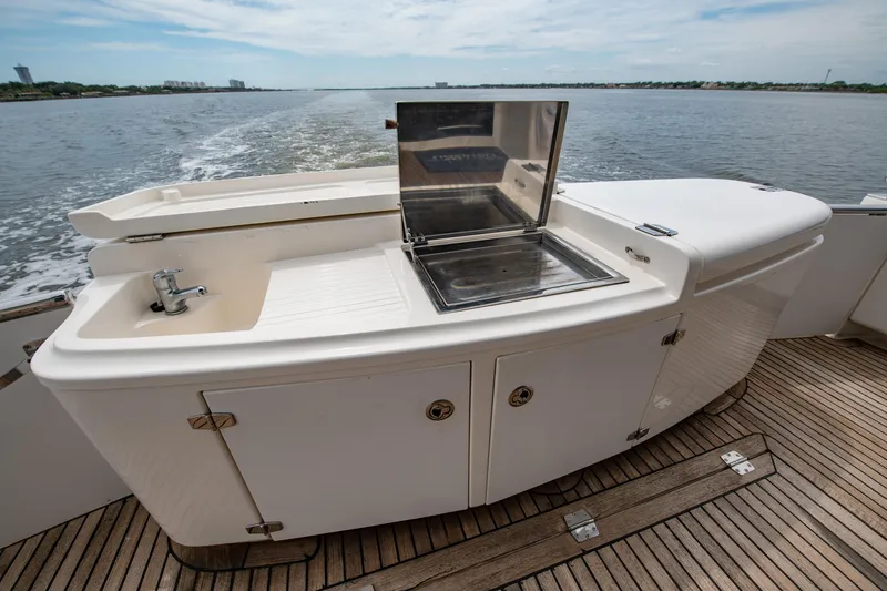 Slide: The Image of 2007 Maritimo Enclosed Fly Bridge yacht with wooden deck and outdoor seating. - 20