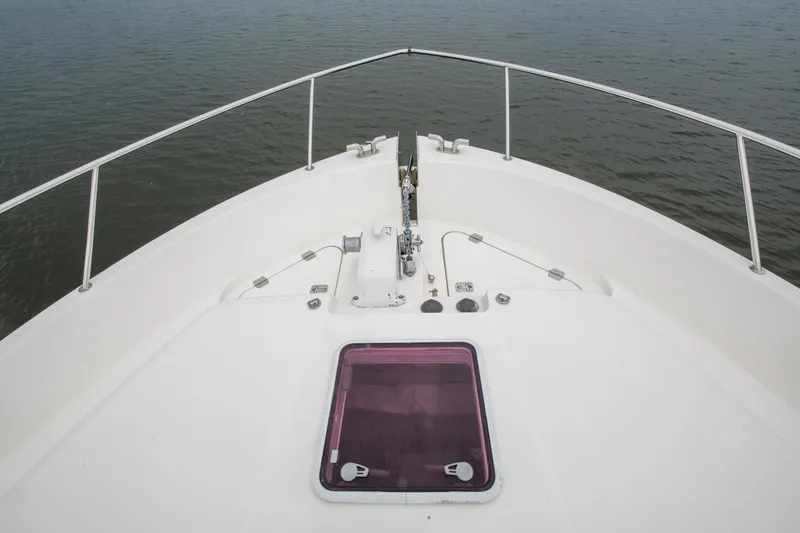 Slide: The Image of 2007 Maritimo Enclosed Fly Bridge deck with crane and hatch covers. - 27