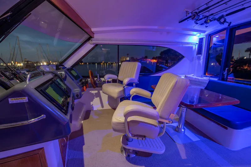 Slide: The Image of 2007 Maritimo Enclosed Fly Bridge yacht cruising on water. - 30