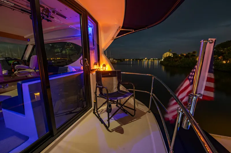 Slide: The Image of 2007 Maritimo Enclosed Fly Bridge interior with captain's chairs and navigation equipment. - 31