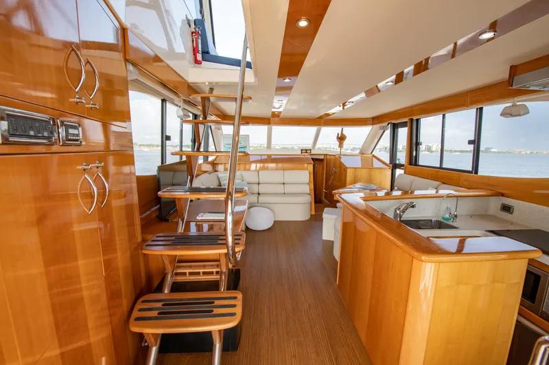Slide: The Image of 2007 Maritimo Enclosed Fly Bridge interior with wooden finishes and modern amenities. - 35