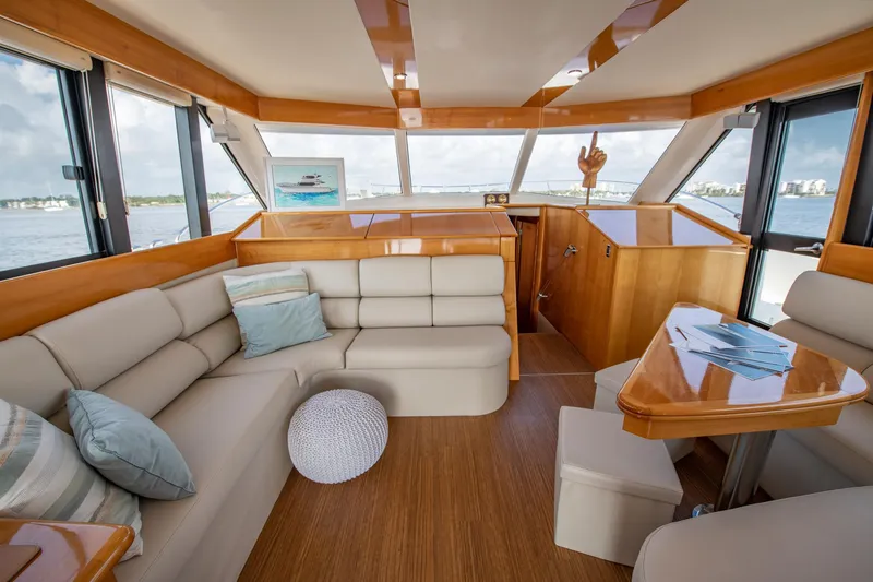 Slide: The Image of Luxurious interior of 2007 Maritimo Enclosed Fly Bridge yacht with wooden finishes and modern amenities. - 36
